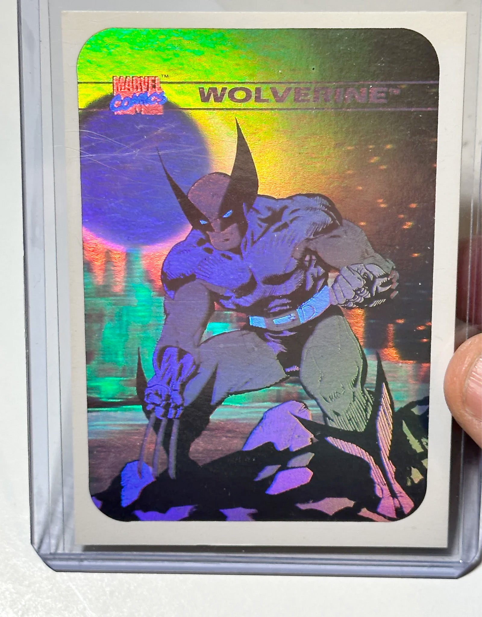 Holographic trading card of Wolverine with colorful border