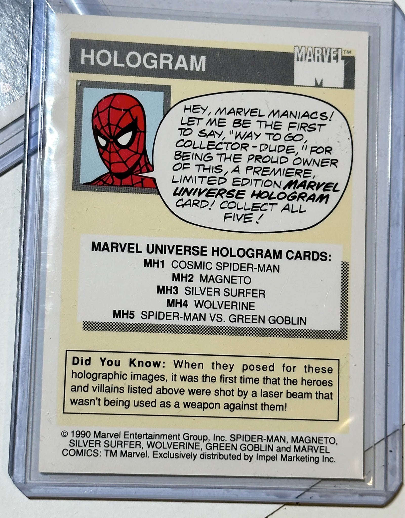 Marvel Universe hologram card with Spider-Man graphic and text in a protective case.