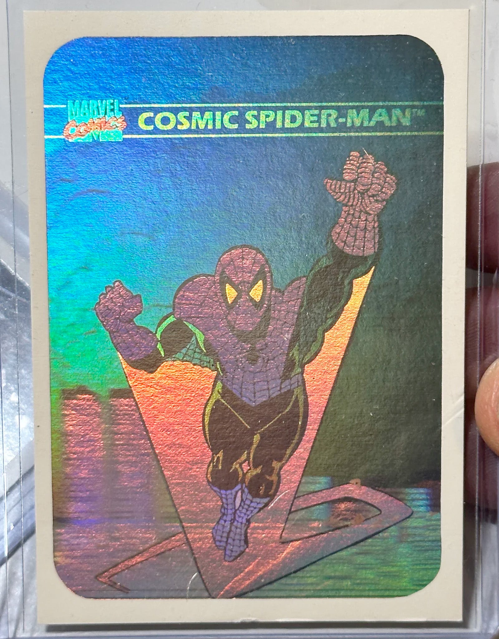 Comic book card featuring Cosmic Spider-Man with a colorful gradient background.
