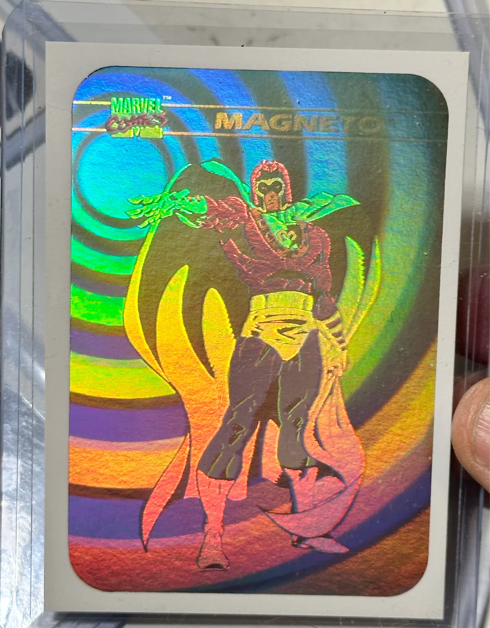 Marvel card featuring Magneto with a colorful, reflective design.
