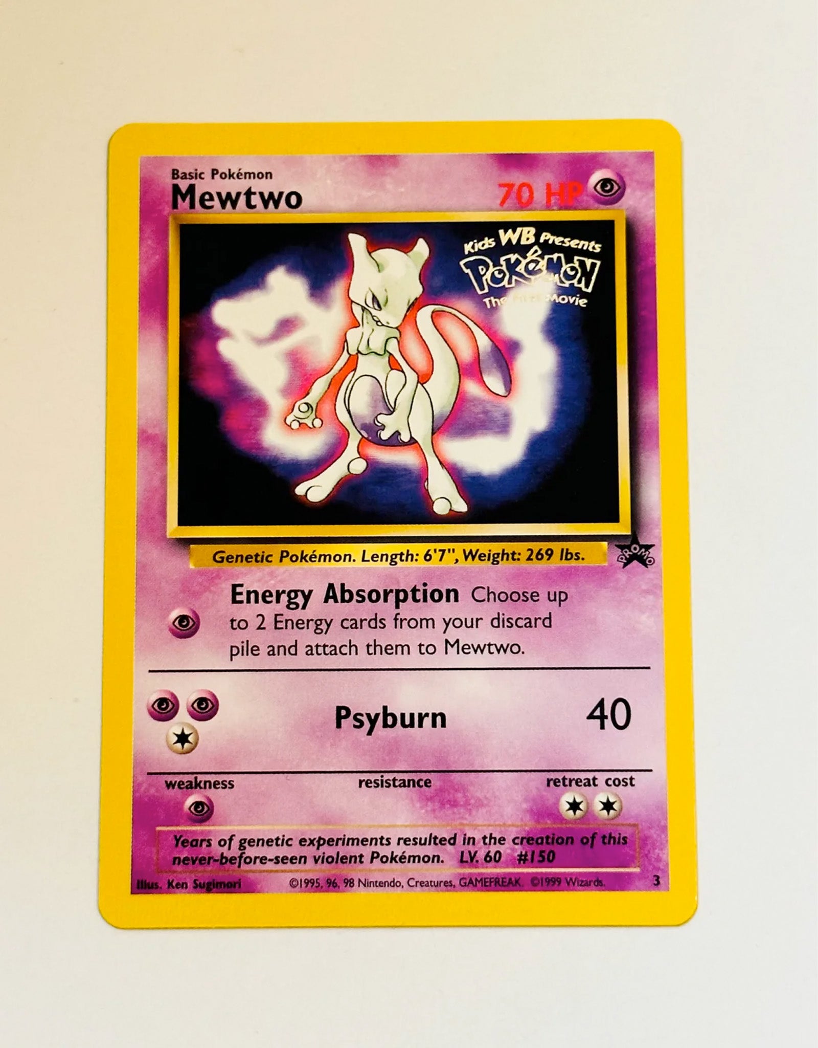 Mewtwo trading card from the Pokémon series on a beige background