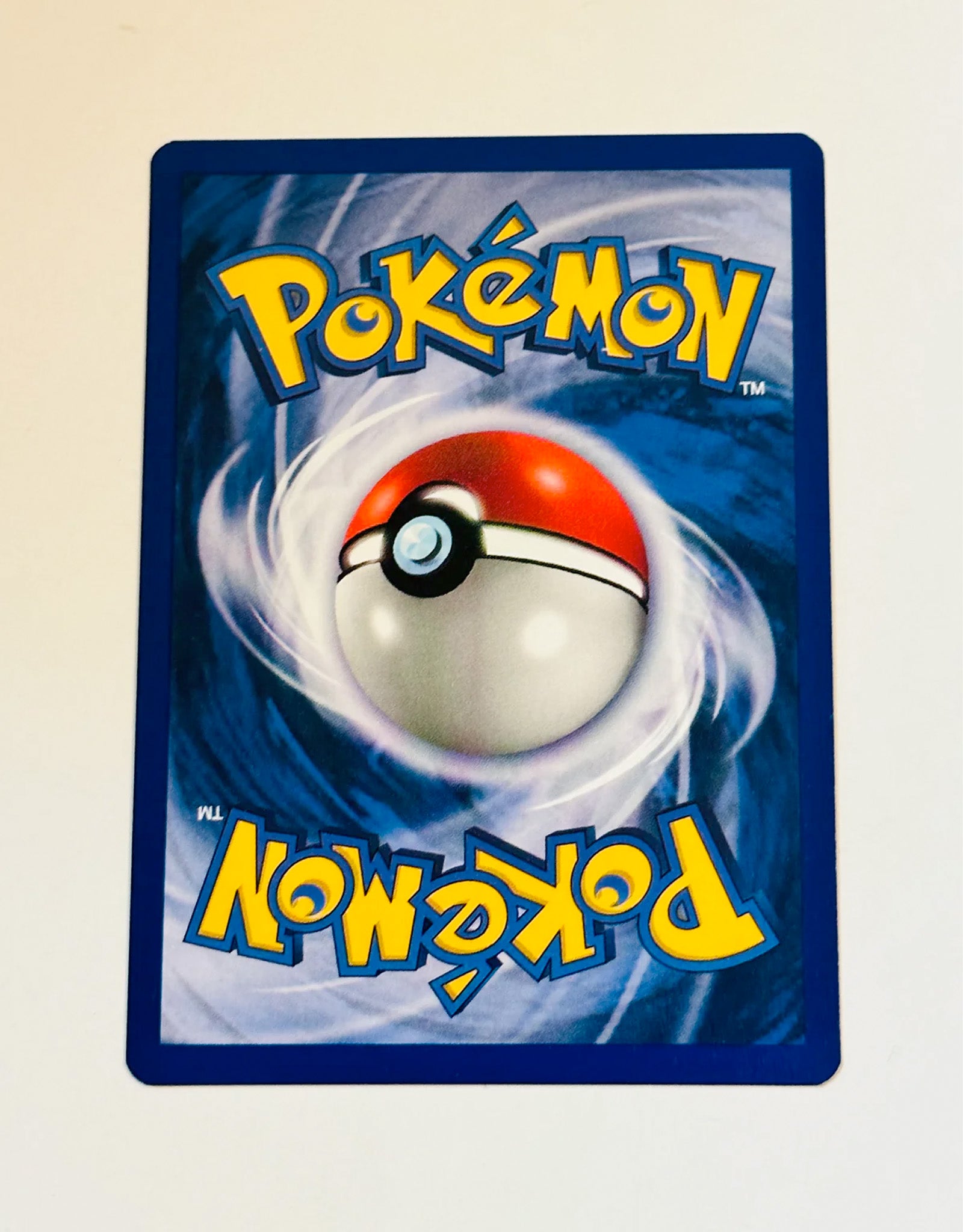 Pokémon trading card with a Poké Ball design on a blue background
