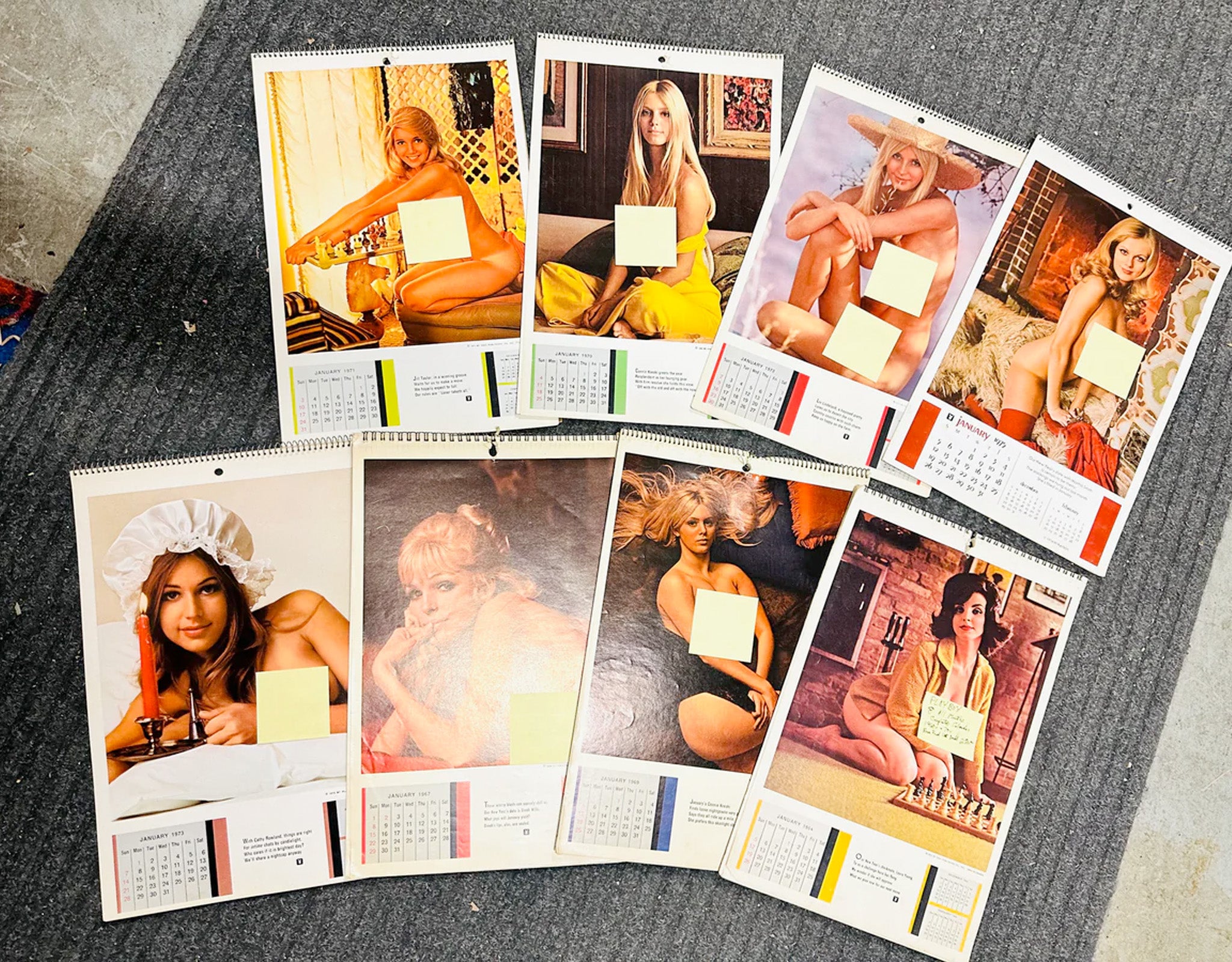 Collection of vintage calendar pages featuring women in various poses on a textured surface.