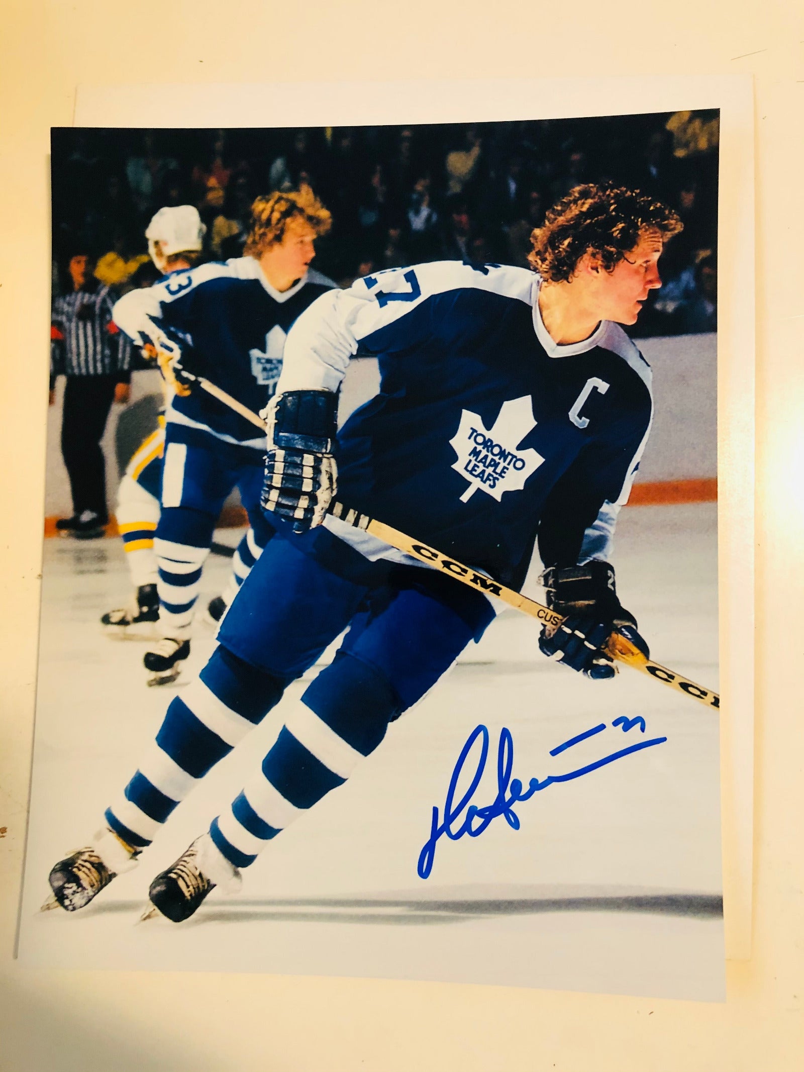 Autograph photo of Darryl Sittler in a Toronto Maple Leafs hockey uniform with his signature and the number 17 on the front.