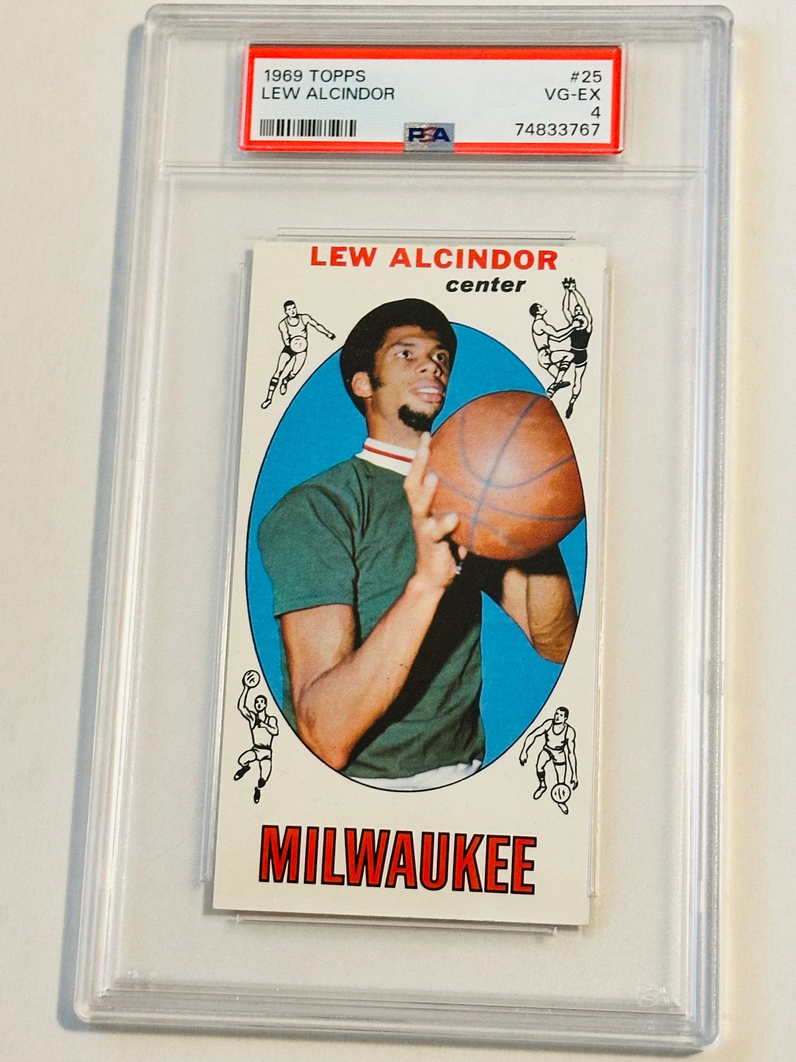 A graded PSA 4 rookie basketball card featuring Kareem Abdul-Jabbar, held in a clear plastic packaging with a red and white label on the top.