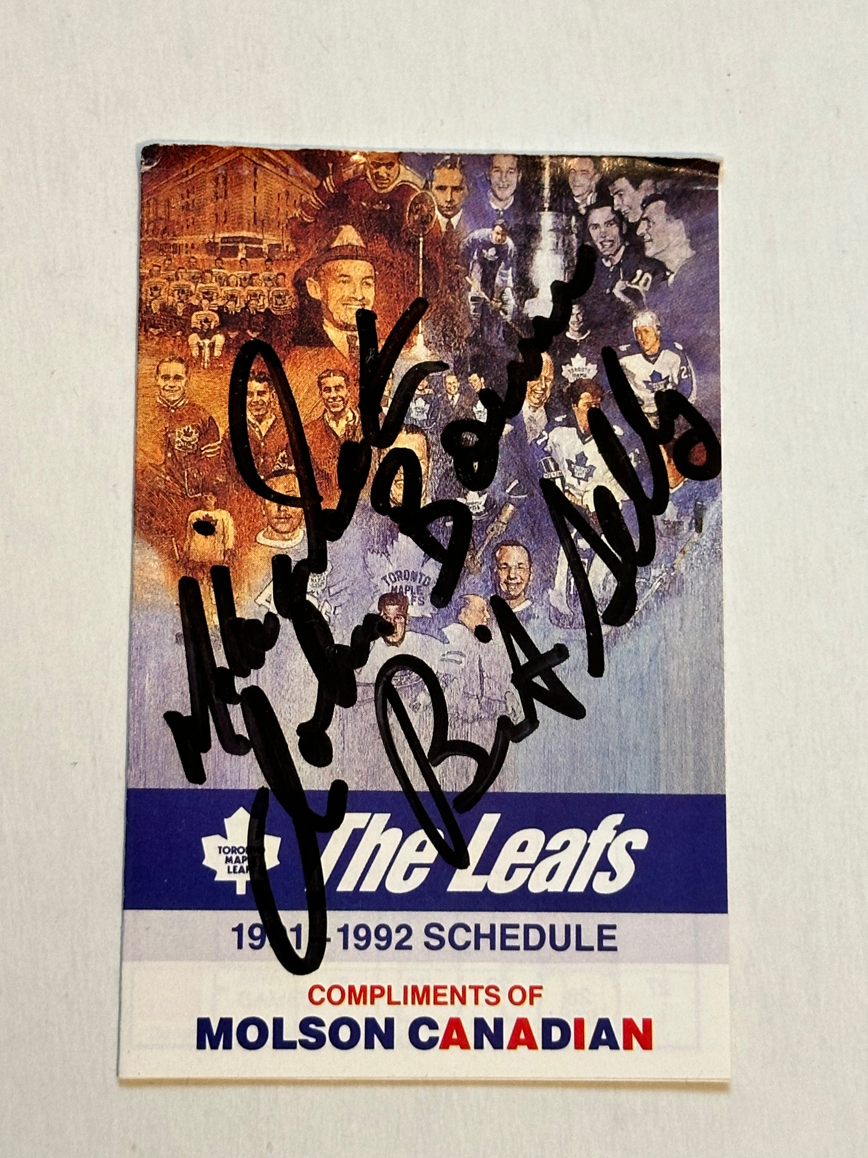 Toronto Maple Leafs vintage hockey schedule signed in person by Johnny Bower and Brit Selby. Sold with COA.