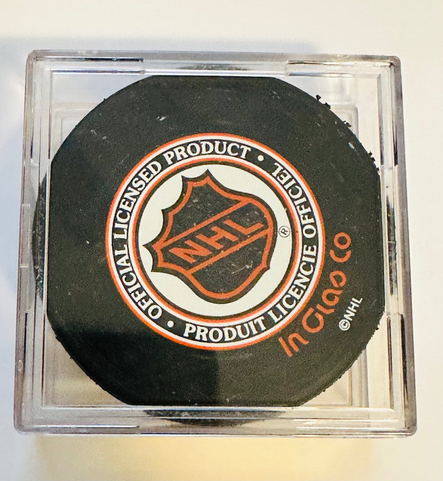 Red Kelly Hockey, legend autograph Puck with puck holder sold the COA