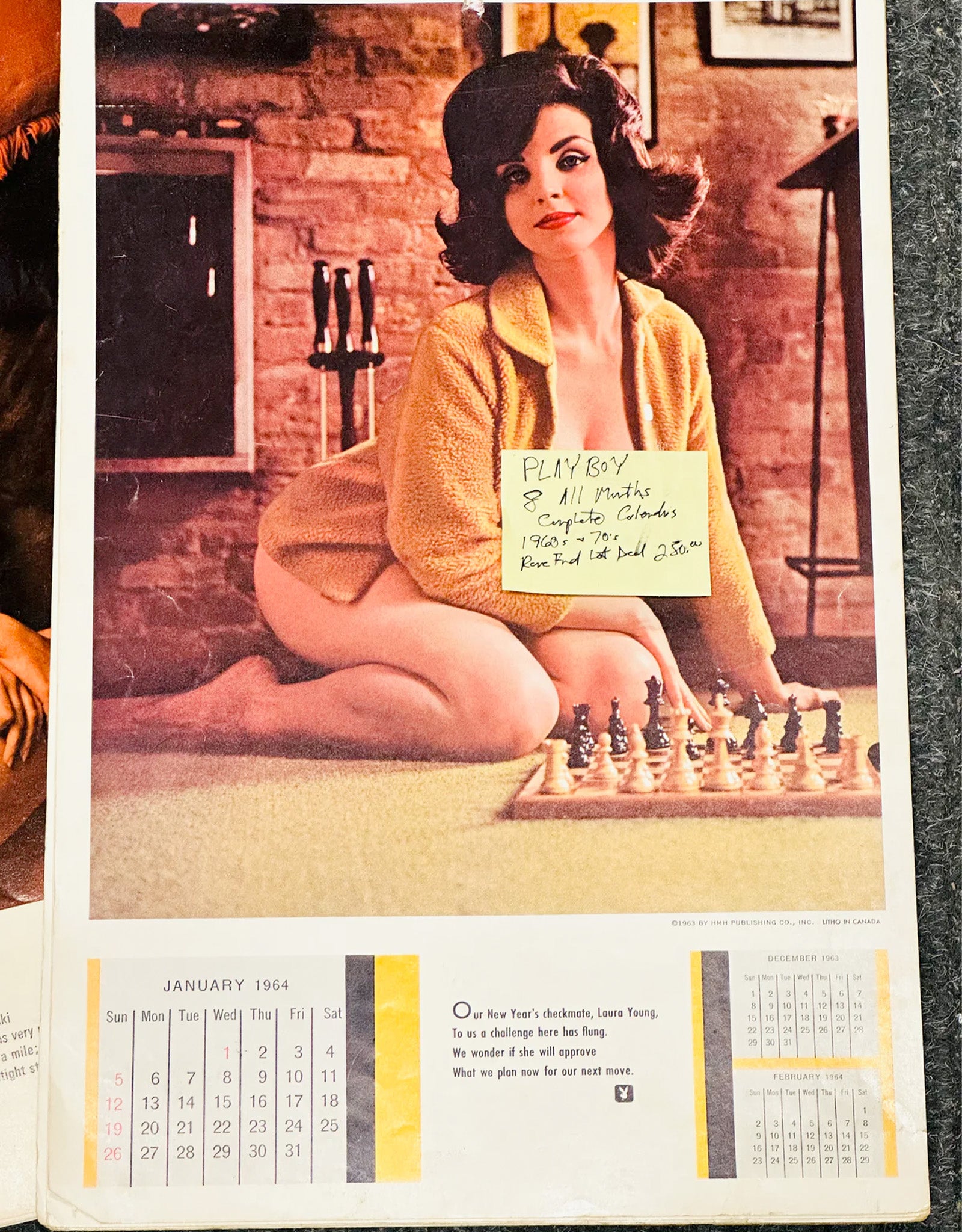 Vintage calendar page with a woman sitting at a chessboard, featuring a chessboard and calendar elements.